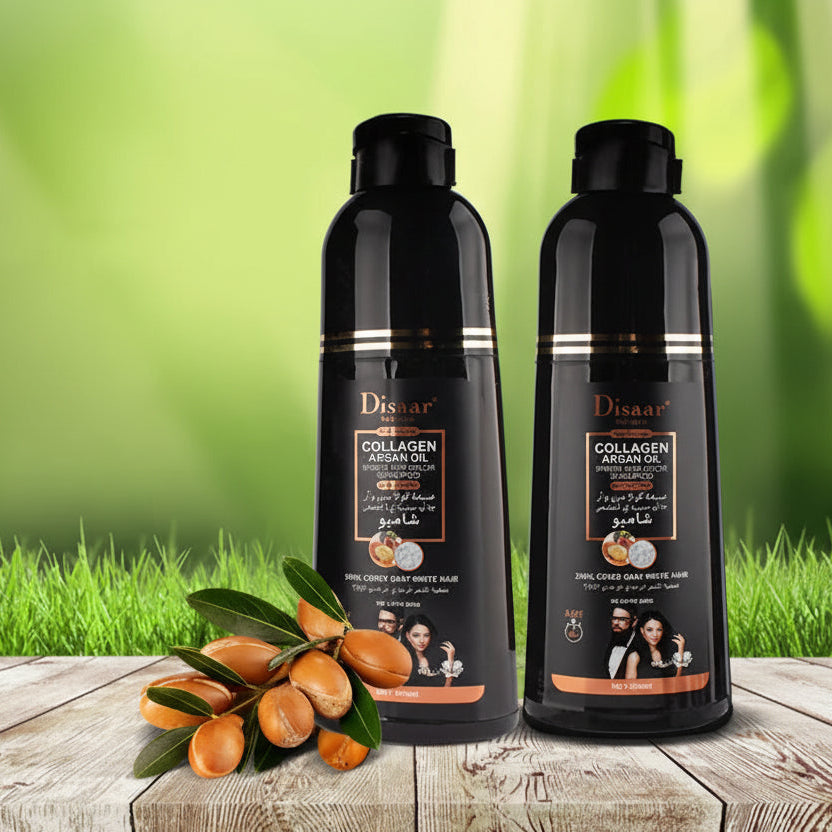 Two bottles of Disaar Collagen Scalp & Hair Color Shampoo on a wooden surface with greenery in the background.