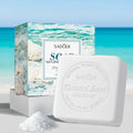 Sea salt oil soap with packaging featuring natural elements and branding on a light background
