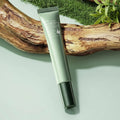 Avocado eye cream with packaging on a natural background