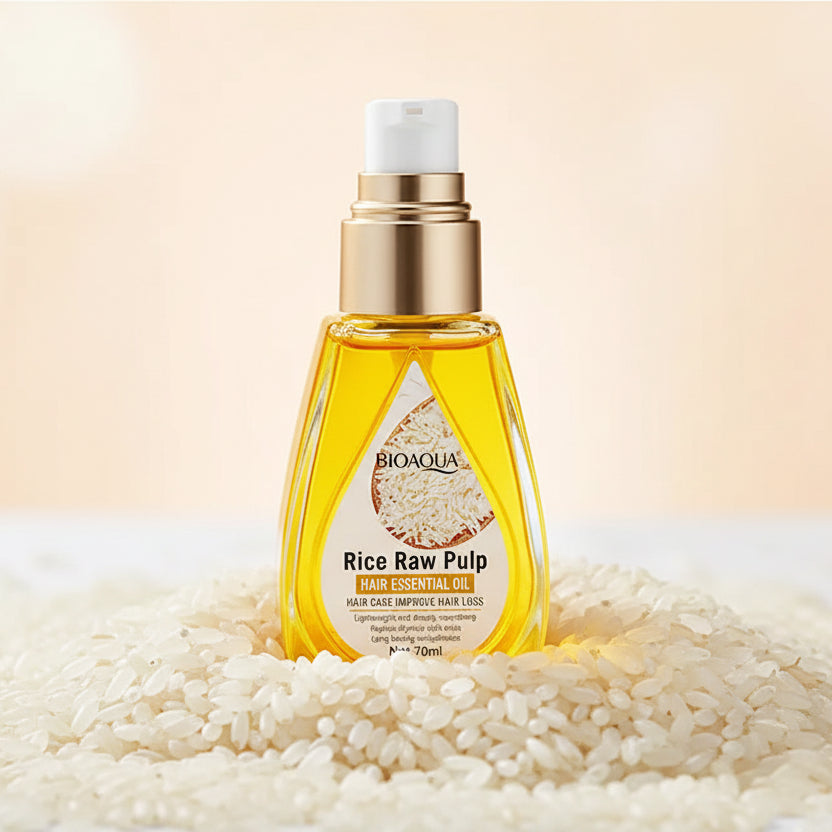 BIOAQUA Rice Raw Pulp oil bottle with a hand applying oil, white flowers in the background