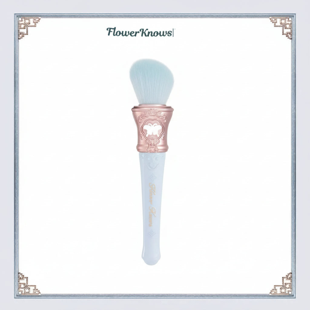 Makeup brush with pink handle and white bristles on a light blue background, featuring the brand 'Flower Knows'.