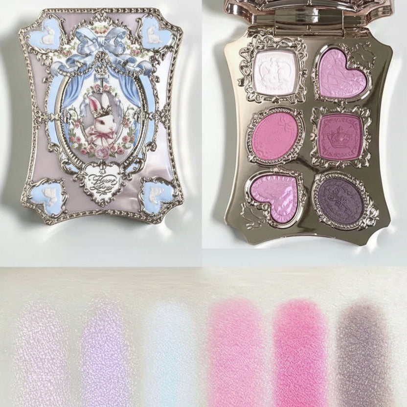 Makeup palette with decorative case and color swatches on a white background